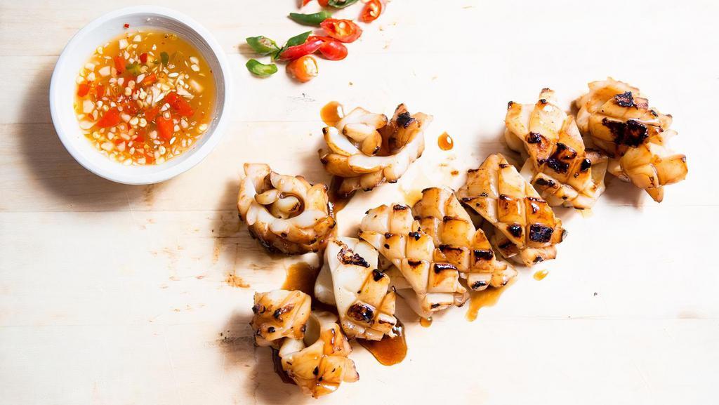 Grilled Calamari · Marinated calamari with Thai spice served with our signature seafood sauce.