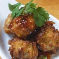 Golden Fritter · Fried chicken and shrimp dumpling with sweet chili dipping sauce.