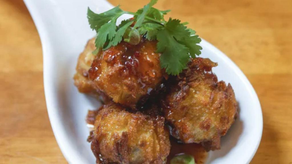 Golden Fritter · Fried chicken and shrimp dumpling with sweet chili dipping sauce.