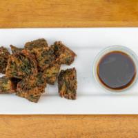 Chive Vegetable Pancake · Vegetable pancake served with homemade black bean mushroom dipping sauce.