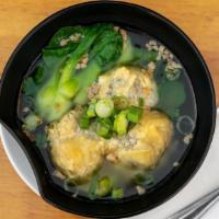 Wonton Soup · Clear soup with homemade chicken and shrimp wonton with baby bok choy.