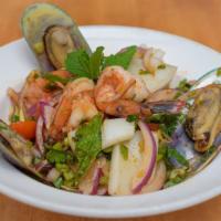 Seafood Salad · Spicy. Shrimp, calamari, mussel tossed with herb and veggie in spicy dressing.