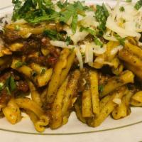 Casarecce Trapanese  · Short dry twisted pasta sauteed with roasted Sicilian eggplant, touch of plum tomato, basil ...