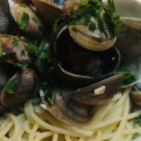 Spaghetti Vongole · Manila clams, roasted garlic, Italian parsley, pepperoncini, olive oil.