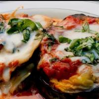 Vegan Eggplant Parmigiana · Slices of eggplant dusted with flour baked with fresh tomato sauce, basil and Pleese Cheese ...