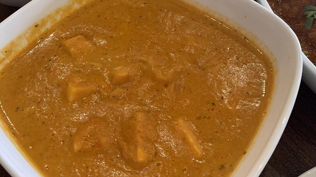 Paneer Butter Masala · Homemade cottage cheese cubes in rich, creamy butter, and tomato-based gravy.