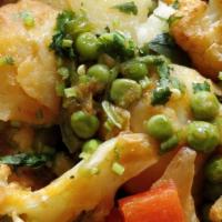 Aloo Gobi Matar · Potatoes, cauliflower, green peas cooked with garlic, onion, fresh cilantro, ginger, tomatoe...