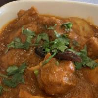 Chicken Vindaloo · Chicken cooked with potatoes and sun-dried kashmiri red-chili in a vindaloo sauce. Spicy. Mi...