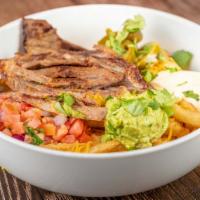Carne Asada Fries · French fries topped with carne asada, shredded cheese, guacamole, sour cream, pico de gallo,...