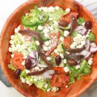 Greek Salad · Lettuce, tomato, cucumber, peppers, onions, feta, anchovies, olives & oregano.