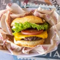 Station Burger · Made fresh to order! Includes cheese, station sauce, lettuce, tomato.