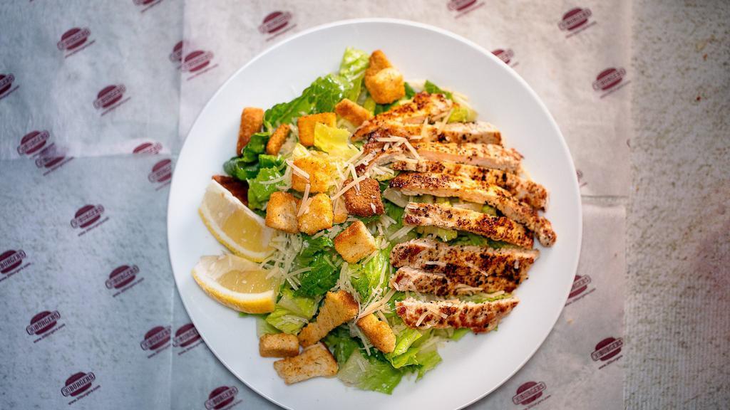 Chicken Caesar Salad · Fresh romaine lettuce, grated Parmesan cheese, seasoned croutons, and fresh grilled chicken.