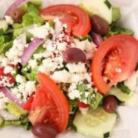 Signature Greek Salad · Fresh romaine lettuce, vine ripened tomatoes, feta cheese, sliced cucumbers, red onions, kal...