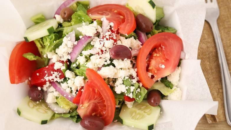 Signature Greek Salad · Fresh romaine lettuce, vine ripened tomatoes, feta cheese, sliced cucumbers, red onions, kalamata olives, peppers, and our signature Greek dressing.