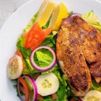 Grilled Tilapia Salad · Fresh tilapia filet served grilled over fresh romaine lettuce, tomatoes, diced onions, and c...
