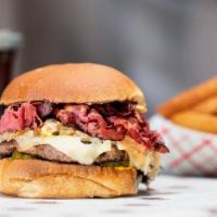 Reuben Burger · Hot pastrami, swiss cheese, sauerkraut, Russian dressing, and pickles on a deli bun.