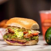 Chicken Club Burger · Flame broiled chicken breast, bacon, swiss cheese, guacamole, red onions, lettuce, and tomat...