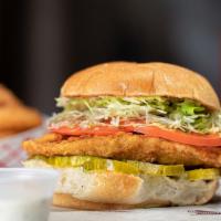 Crispy Buffalo Chicken Burger · Lightly fried chicken breast, buffalo sauce, lettuce, tomato, and ranch on the side on a fre...