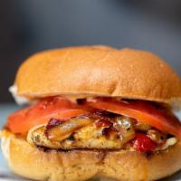 Cajun Grilled Chicken Burger · Boneless chicken breast with Cajun seasoning, topped with roasted red peppers, sautéed onion...