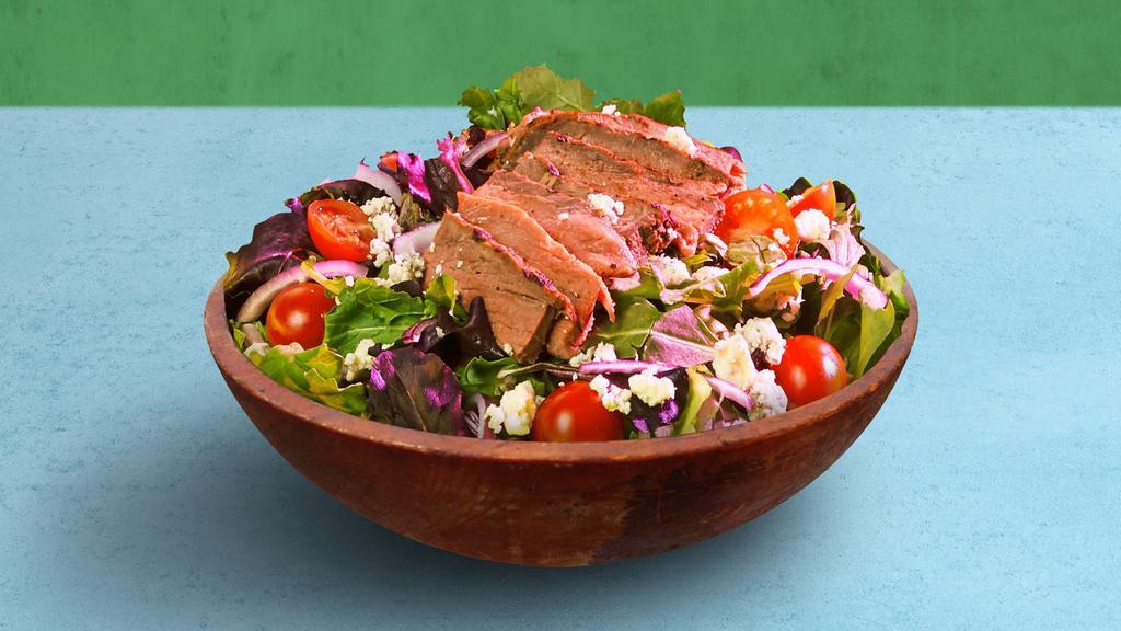Steak Salad · Choice of greens, sliced steak, tomatoes, onion, and blue cheese, tossed with your choice of dressing.