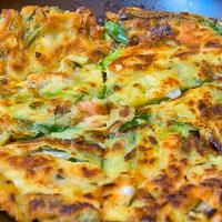 Pajeon Seafood · Korean pancake with seafood, sliced scallion and assorted vegetables