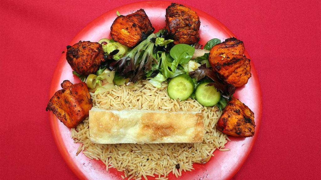 Chicken Tikka · Served with brown rice salad and bread.