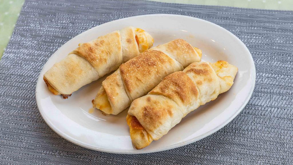 Pizza Rolls · With choice of buffalo chicken, chicken parm, sausage & peppers, chicken marsala or eggplant, mozzarella & roasted pepper, ham, pepperoni & cheese.