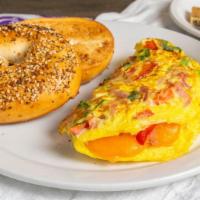 Western Omelet · Three-egg omelet with cheese, sauteed onions and peppers, and diced smoked ham & choice of b...