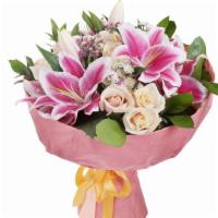 Pink Lilies With Roses · Gorgeous mix of huge Dutch pink lilies and Ecuadorian roses with lush greenery and filler fl...
