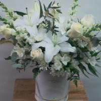 Luxury White Box · White Lilies, Roses, Snapdragons, and other mixed white blooms in a stylish hat box . Perfec...