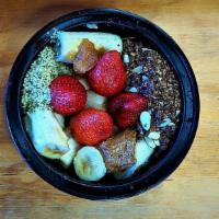 Cacaolandia Bowl · Banana • Hemp Seeds • Topped with Chocolate Almond Granola • Strawberries • Red Seedless Gra...