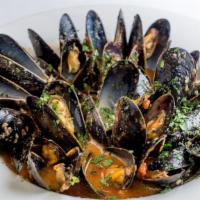 Pei Mussels · In a garlic and herb brodetto; choose red or white wine sauce.