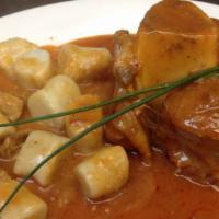 Osso Buco · Our famous braised veal shank served with choice of rice or gnocchi.