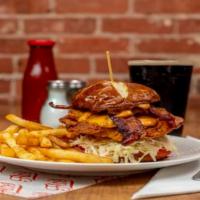 Fried Chicken Sandwich · Flo's hand-battered fried chicken with homemade coleslaw, melted cheddar cheese, bacon, slic...