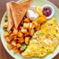 Western Omelet · Red and green peppers, scallions, ham, and Cheddar cheese.
