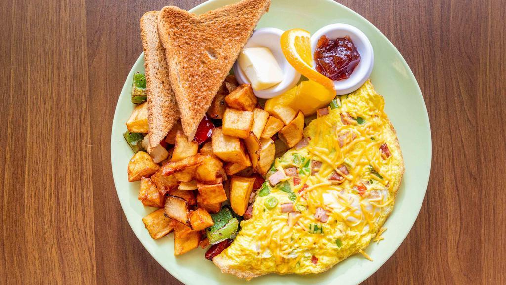 Western Omelet · Red and green peppers, scallions, ham, and Cheddar cheese.