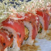 Flaming Ahi Roll · Avocado, green onion, mayonnaise, Ninja Sauce & tenpura flakes topped with shichimi -seared ...
