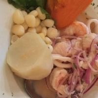Ceviche Mixto · Mix of fresh seafood and fish chunks, in a spicy lime sauce served with sweet potatoes and w...
