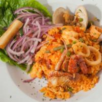 Arroz Con Mariscos · Rice cooked in a braised seafood, saffron and Peruvian peppers sauce.