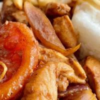 Pollo Saltado · Traditional Peruvian style stir fry of chicken chunks; sauteed with soy sauce, onion, tomato...