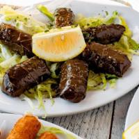 Grape Leaves · 6 rolled grape leaves drizzled with EVOO and Greek oregano