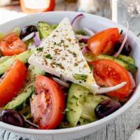 Small Greek Salad · mixed iceberg and romaine lettuce, ripe tomatoes, red onions, cucumbers, kalamata olives, Gr...