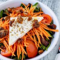 Small Santorini Salad · mixed greens, tomatoes, cucumbers, Greek figs, shredded carrots and feta cheese drizzled wit...
