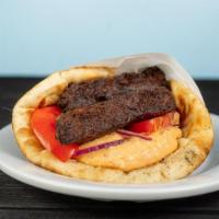 Zucchini Pita · served with tomatoes, red onions and tzatziki all wrapped inside a toasted regular pita