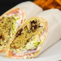 Falafel Or Zucchini Fritters Wrap · Falafel or Zucchini, lettuce, tomatoe and tzatziki in your choice of wrap.