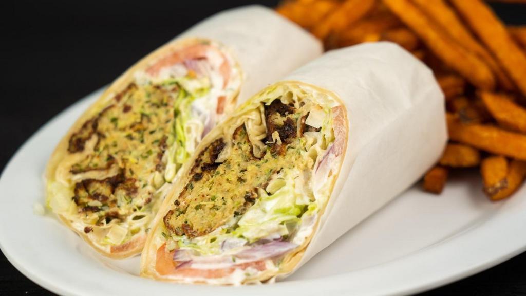 Falafel Or Zucchini Fritters Wrap · Falafel or Zucchini, lettuce, tomatoe and tzatziki in your choice of wrap.
