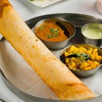 Masala Dosa · Crisp and savory crepe made of lentils, and curry leaves, with potatoes served with chutneys...