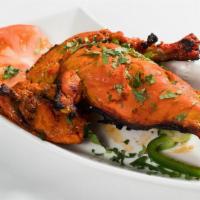 Tandoori Chicken · Bone-in chicken marinated in spices and roasted