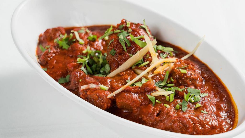 Lamb Vindaloo · Lamb cooked with potatoes in a flavorful curry