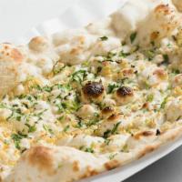 Garlic Naan · Soft leavened bread with garlic in clay oven